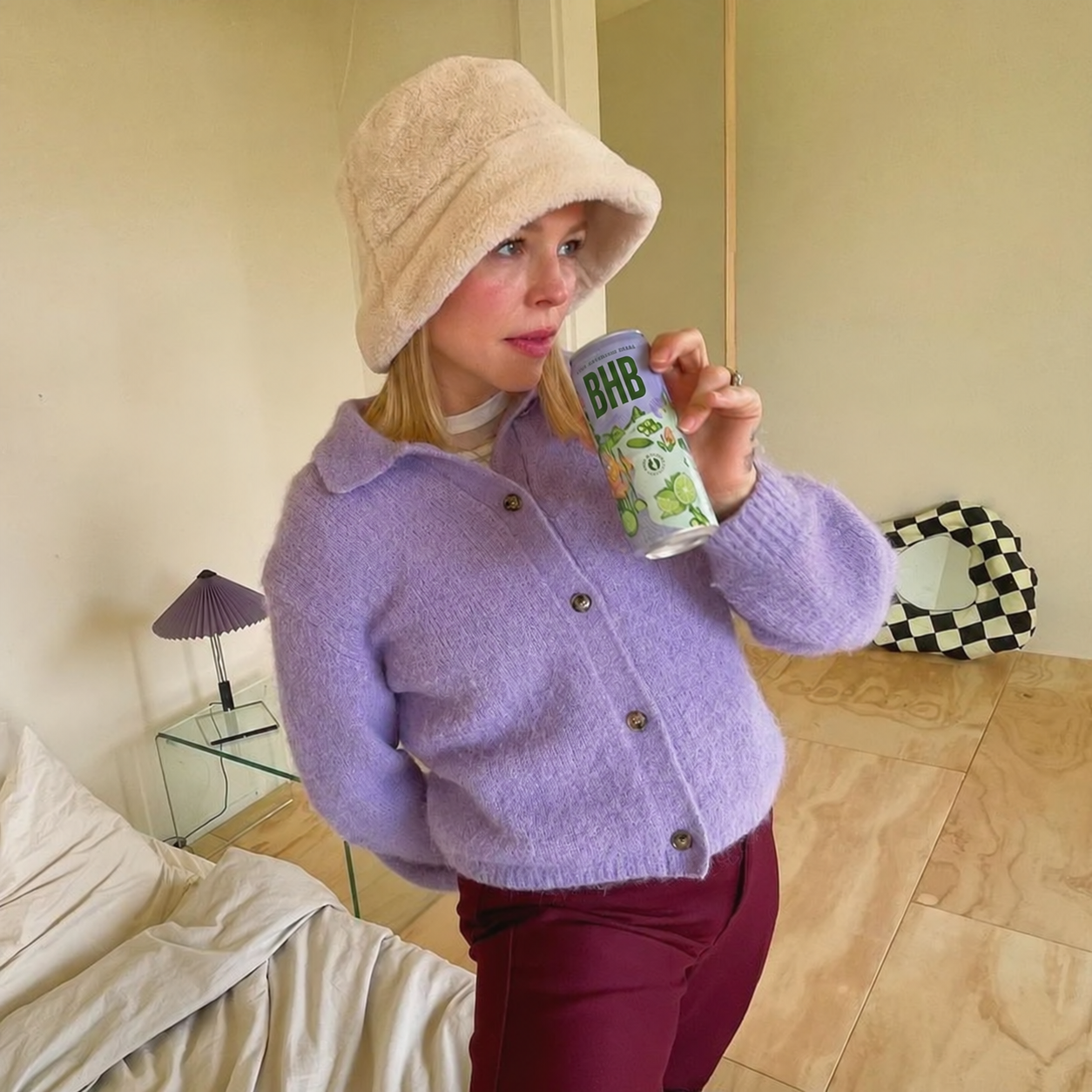 A woman enjoying an herbal sparkling drink