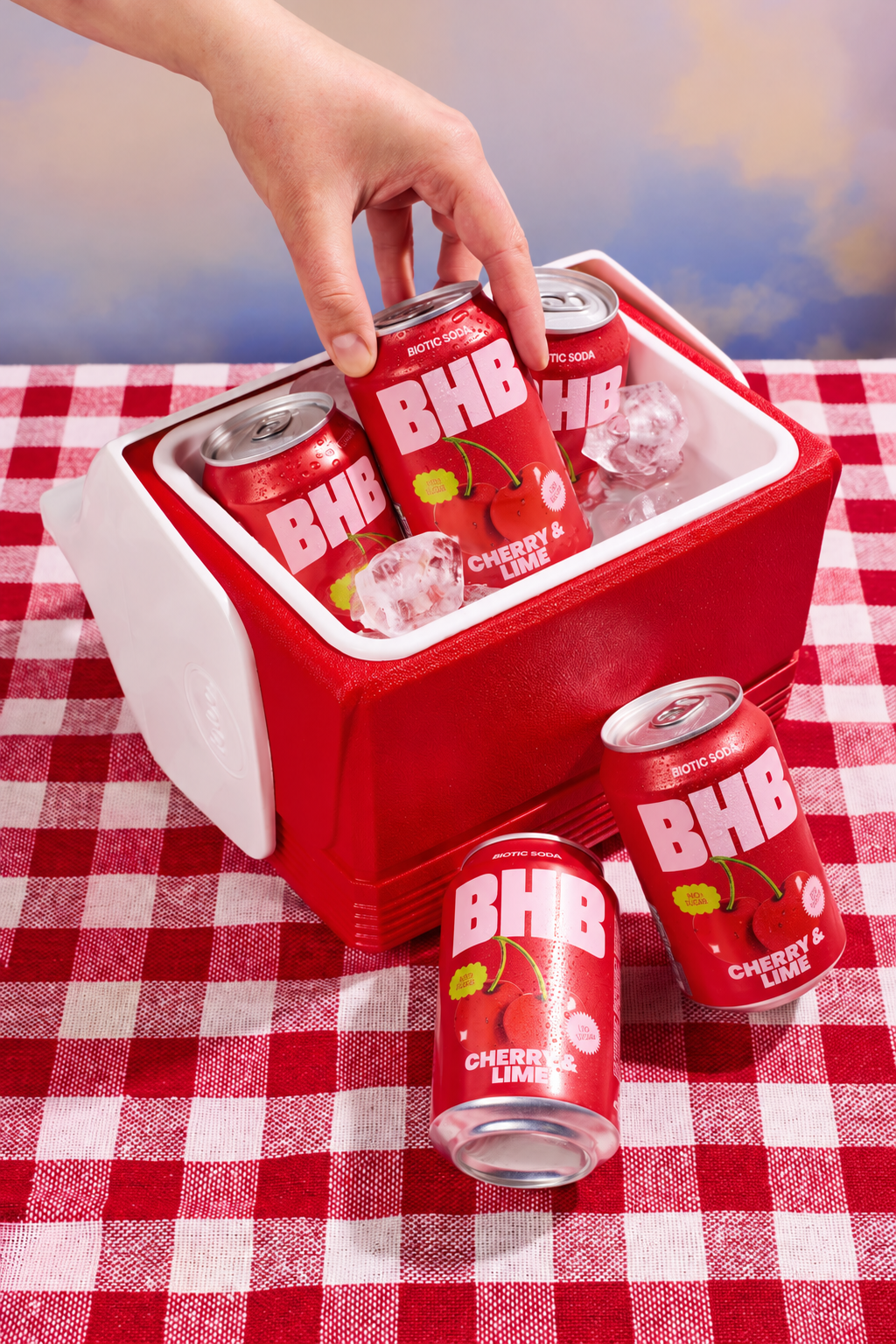 Cherry and lime cans in a picnic cooler