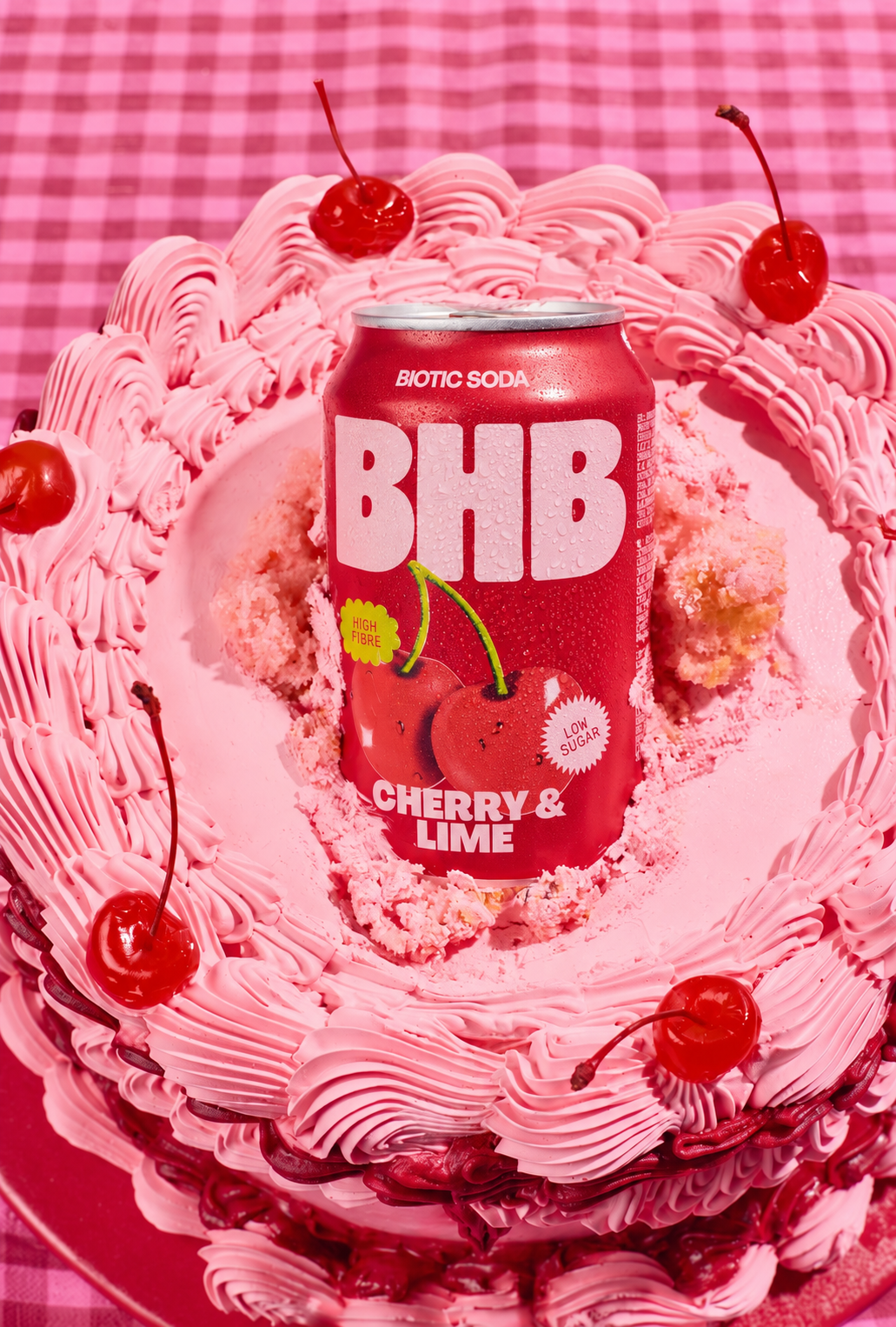 Cherry and lime can with a pink cake